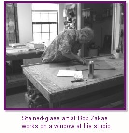 Bob Zakas works on stained glass windows